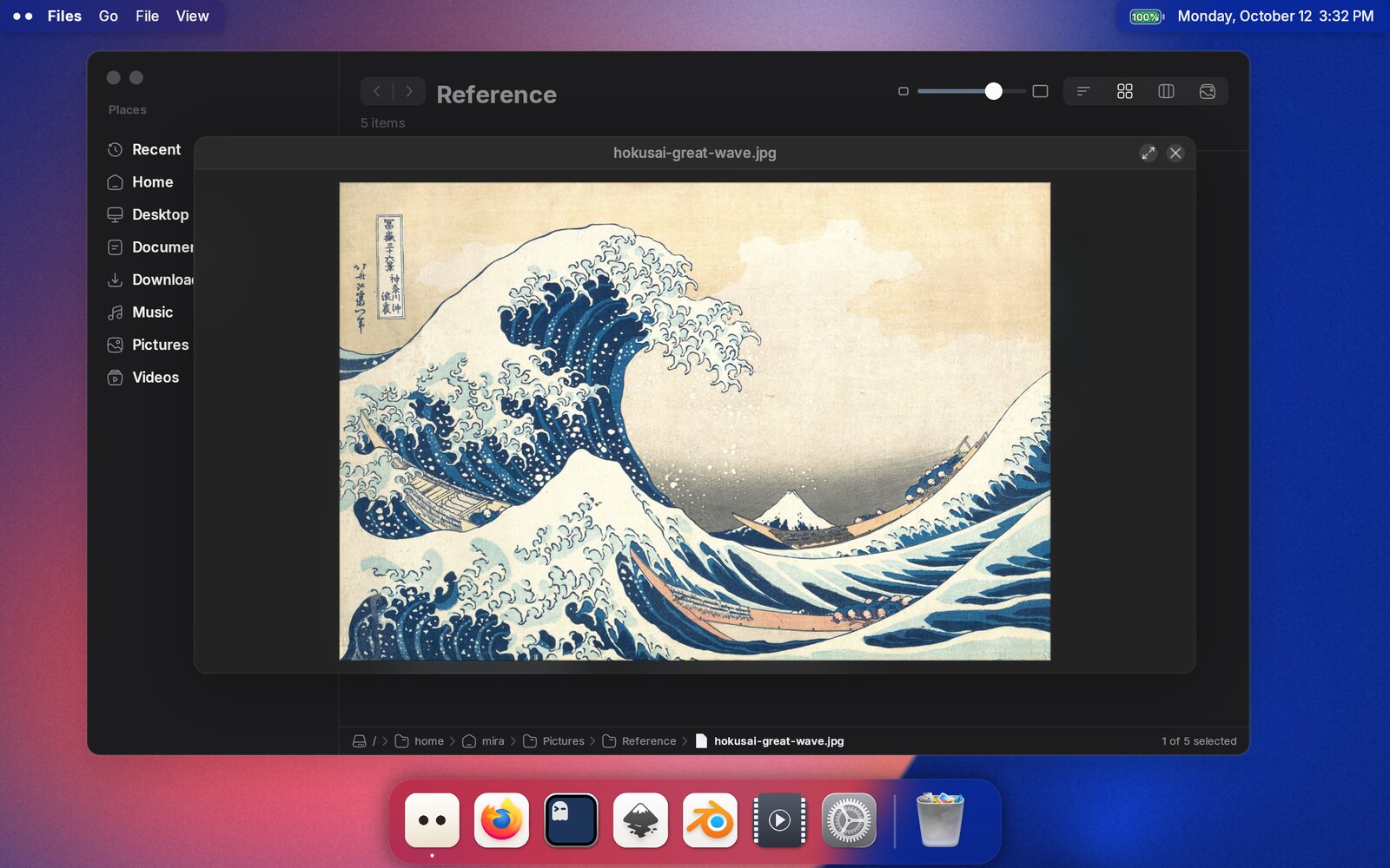 Peek open on a picture: the image fills a panel over the Files window, with the file name above it and buttons to expand or close